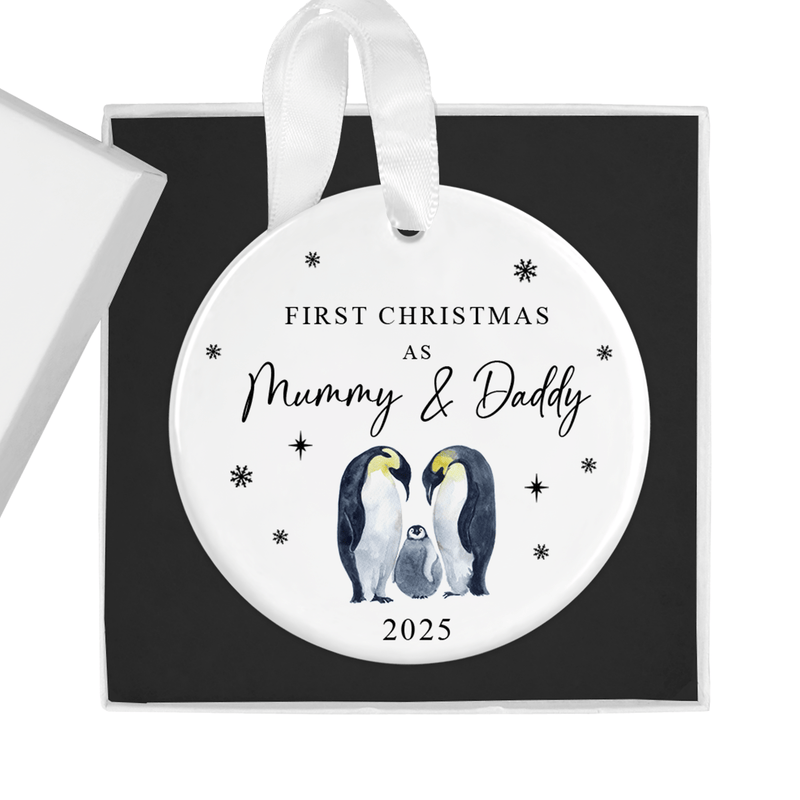 ceramic ornament with two proud parent penguins with their adorable chick