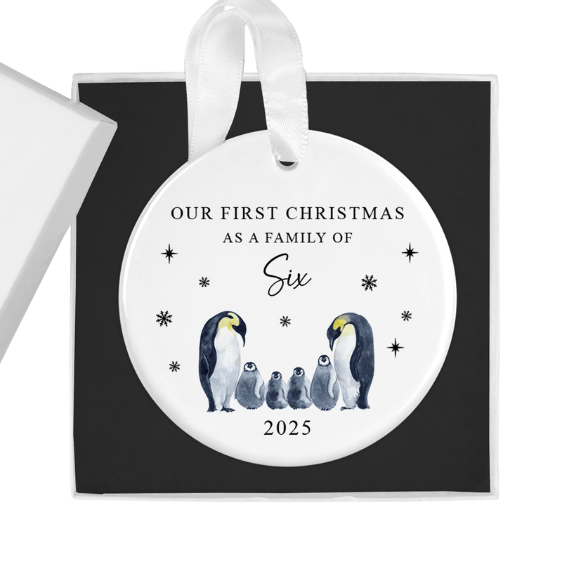 ceramic ornament with two loving parent penguins and four adorable chicks
