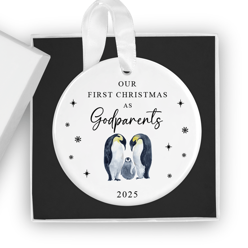 ceramic ornament with two loving penguins with their chick