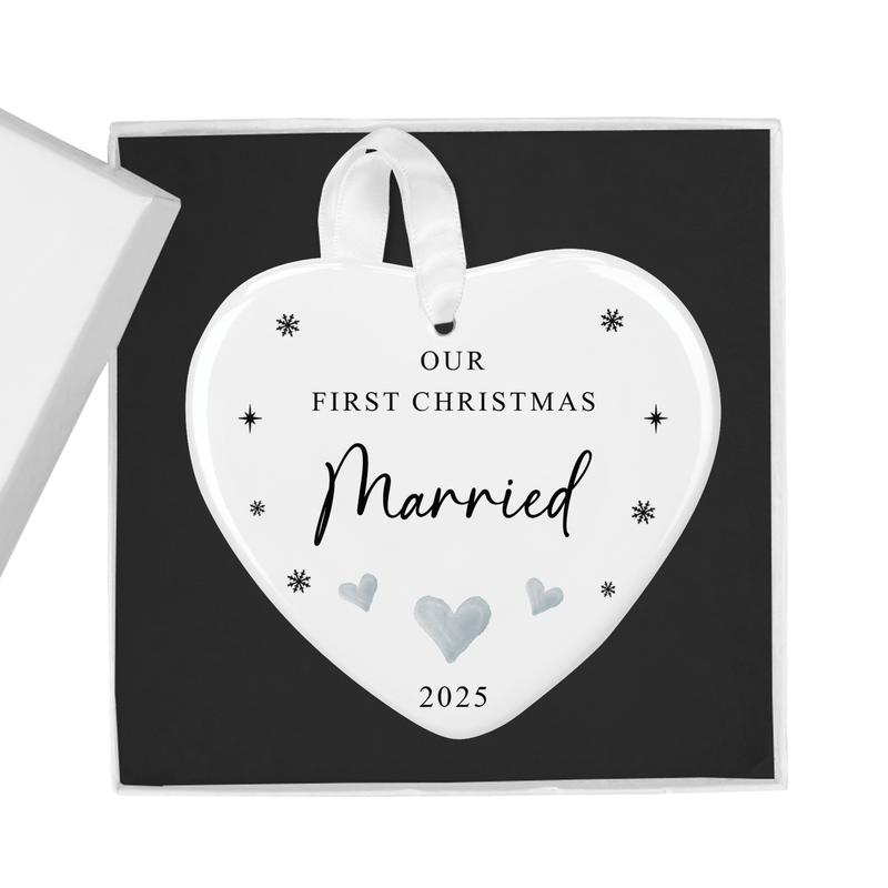 ceramic ornament with a simple design with delicate snowflakes and soft grey heart details
