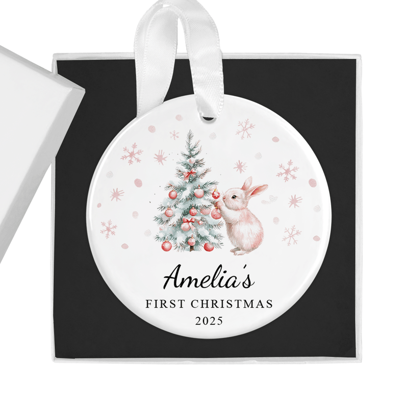 Personalised ceramic ornament with a sweet bunny decorating a Christmas tree with pink baubles