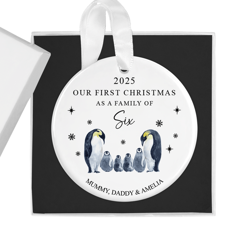 Personalised ceramic ornament with two proud parent penguins with four adorable chicks