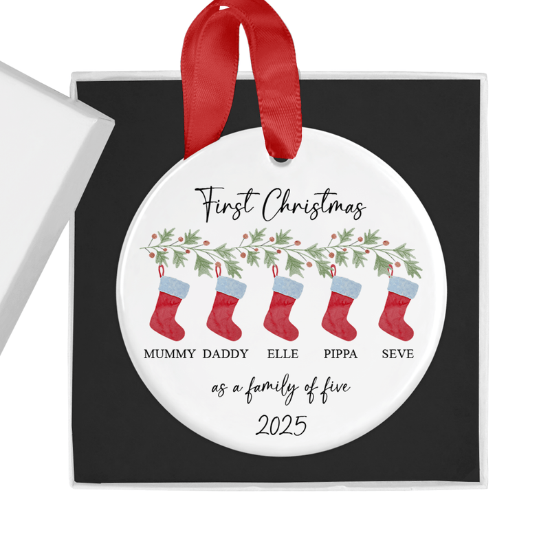 Personalised ceramic ornament with a festive row of red Christmas stockings hanging from holly and greenery