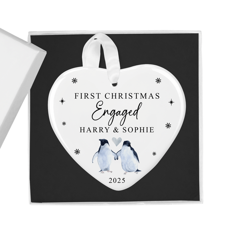 Personalised ceramic ornament with two sweet penguins holding a heart