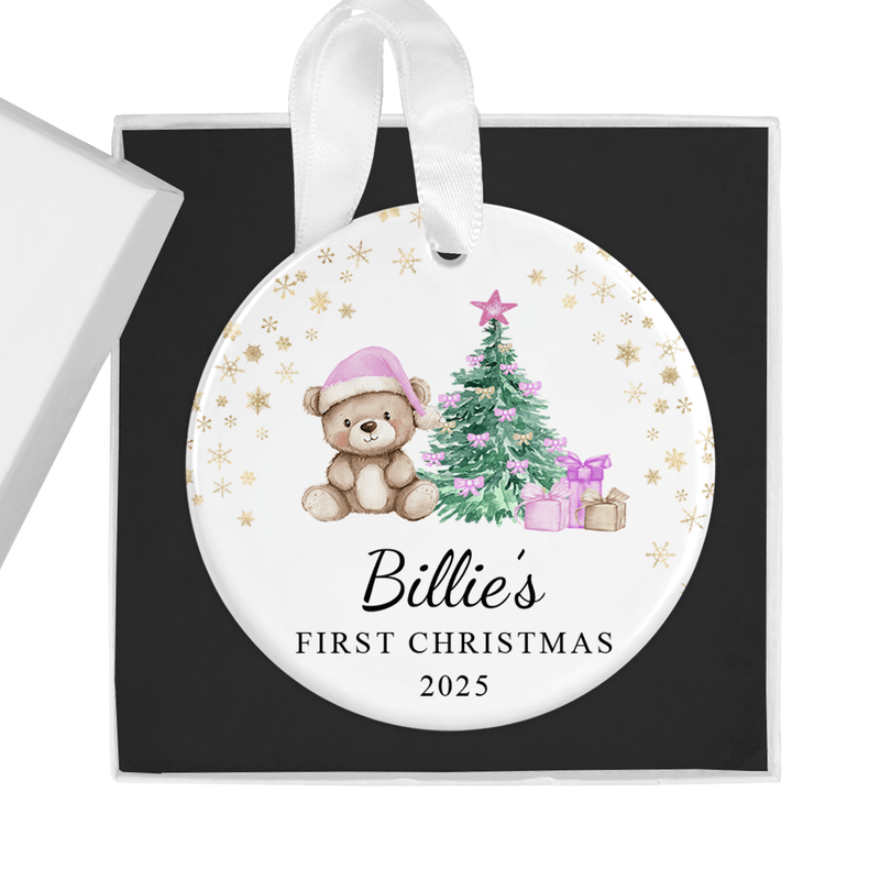 Personalised ceramic ornament with an adorable teddy in a pink Santa hat beside a Christmas tree