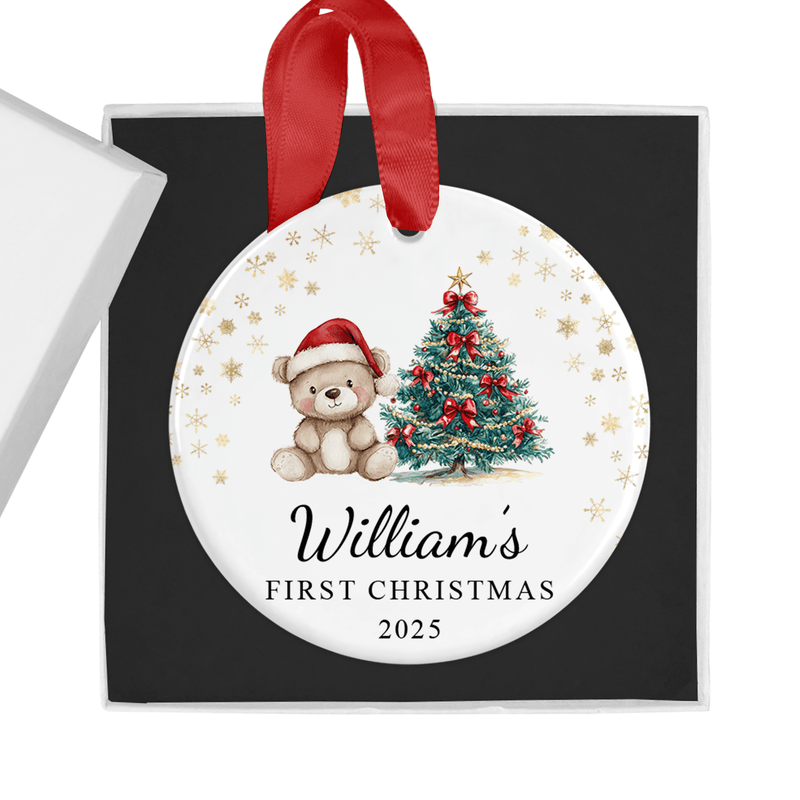 Personalised ceramic ornament with an adorable teddy in a Santa hat beside a Christmas tree