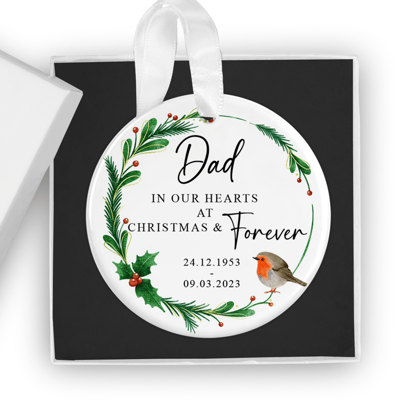Personalised ceramic ornament with a peaceful robin and elegant festive wreath