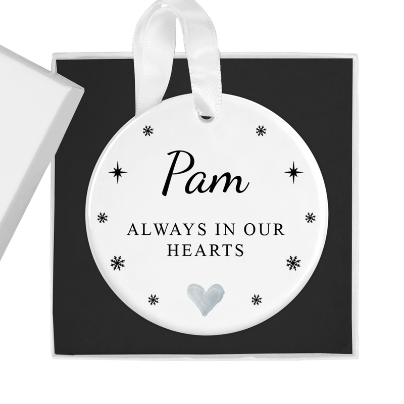 Personalised ceramic ornament with a classic black-and-white memorial design with stars, snowflakes and a soft heart