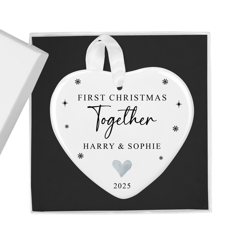 Personalised ceramic ornament with an elegant script with delicate snowflake accents and a subtle heart motif