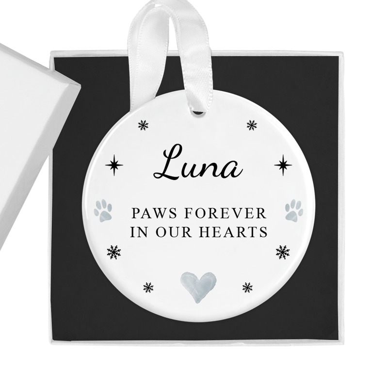 Personalised ceramic ornament with a paws for years to come in Our Hearts message with paw prints and the pet name