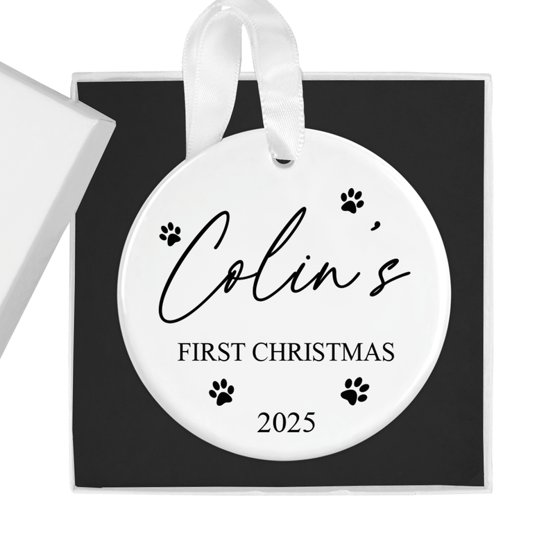 Personalised ceramic ornament with a sweet and simple design with paw prints surrounding the pet name