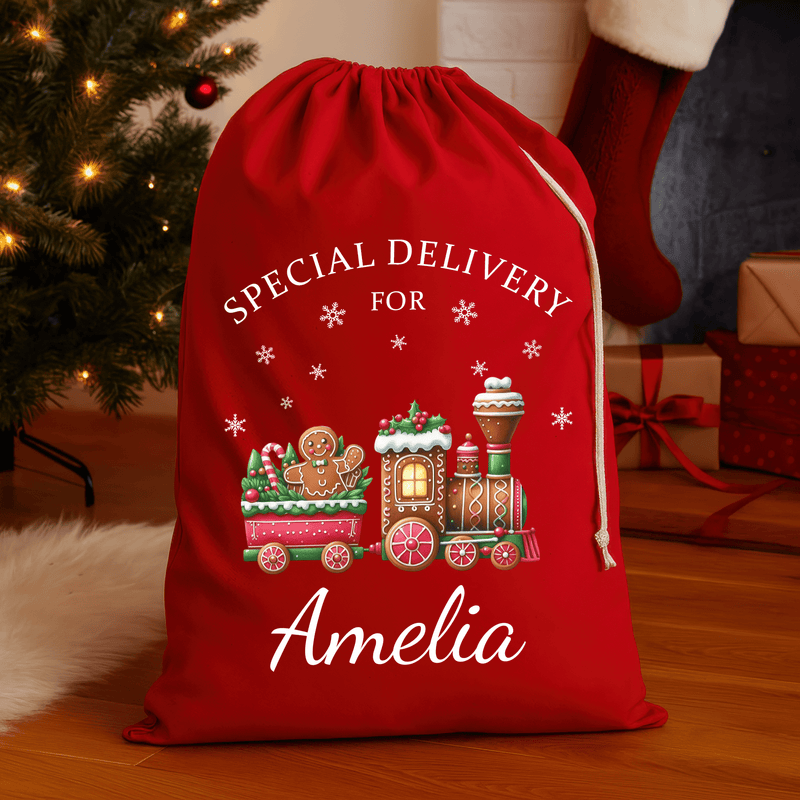 Personalised red Christmas sack with gingerbread train design and printed name