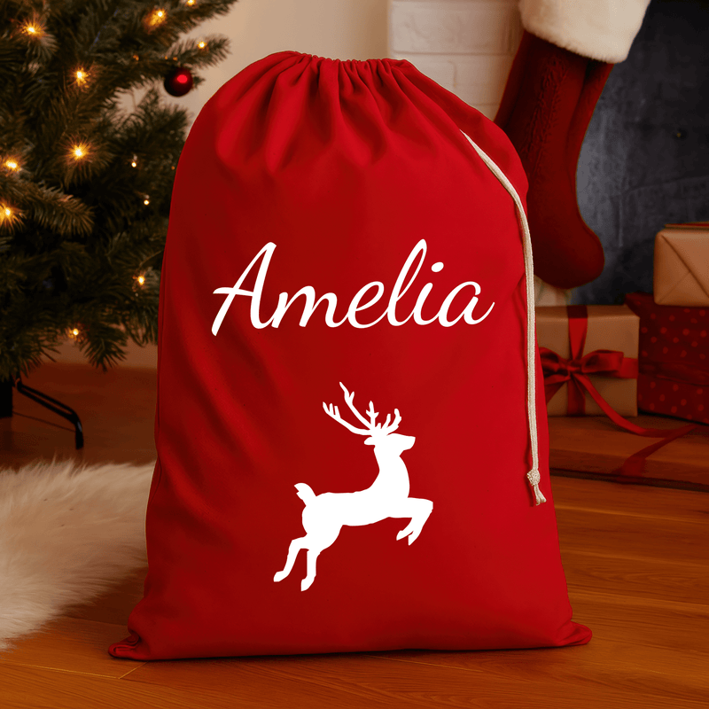 Personalised red Christmas sack with white reindeer design and printed name