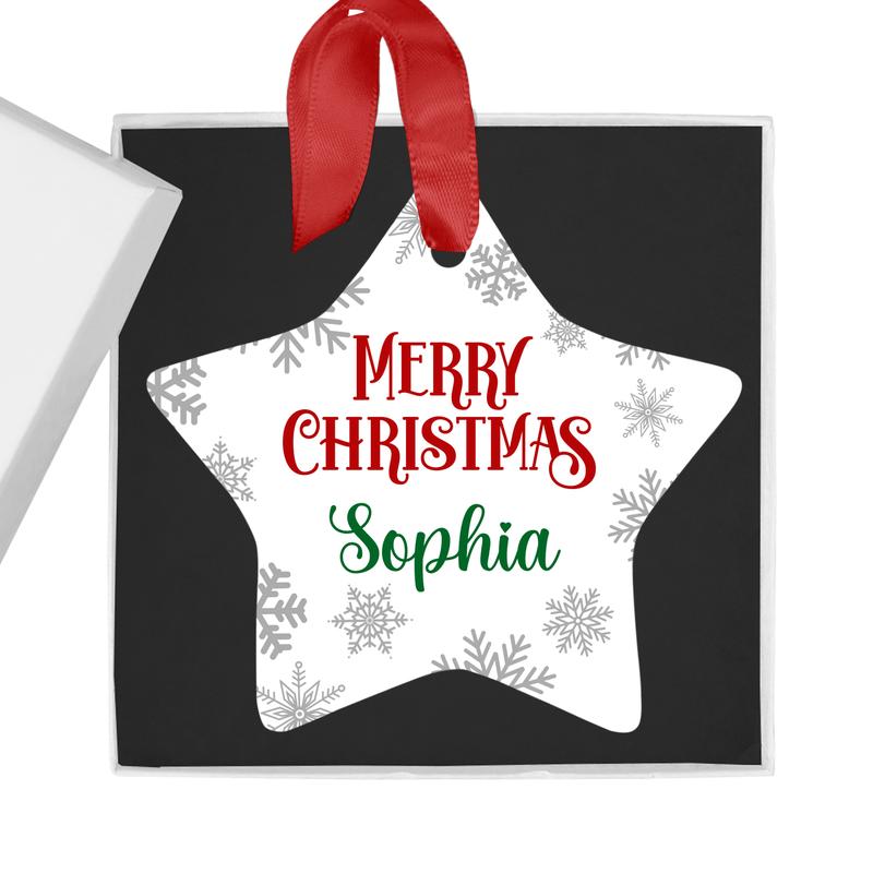 Personalised ceramic ornament with a star-shaped Merry Christmas design with snowflakes and red-and-green lettering