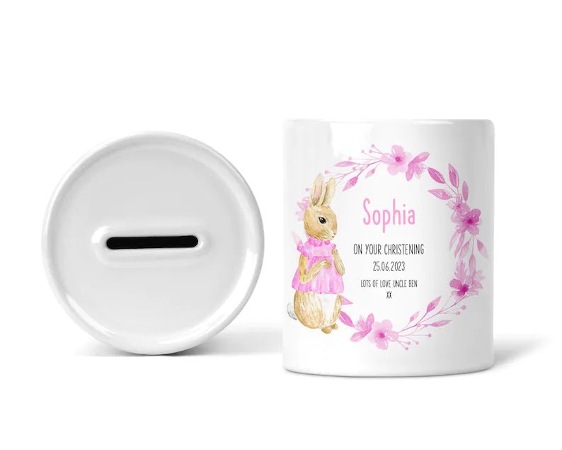 Personalised Pink Bunny Wreath Christening Money Box shown as a ceramic keepsake