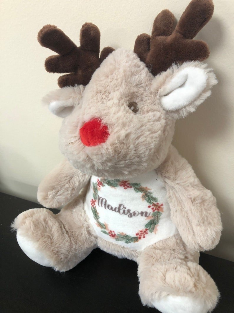 Personalised 1st Christmas Red Reindeer Soft Toy with Wreath showing wreath