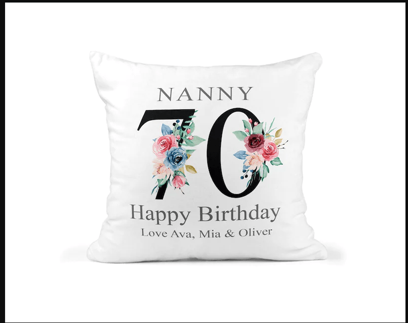 Personalised Nanny 70th Birthday Cushion with Names showing a floral milestone design front view