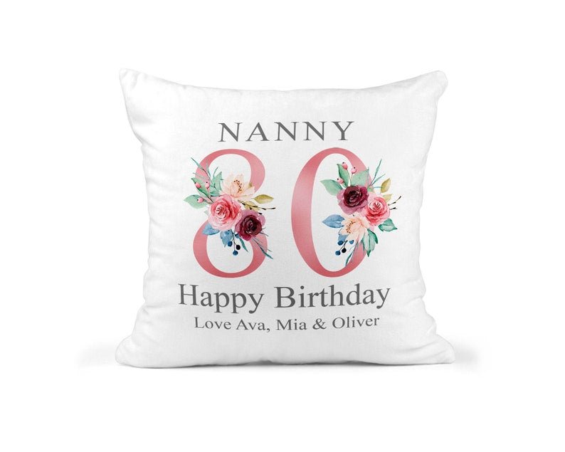 Personalised Nanny 80th Birthday Cushion with Names showing a floral milestone design front view