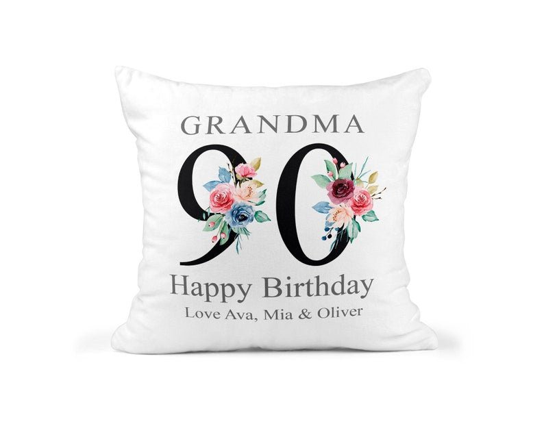 Personalised Nanny 90th Birthday Cushion with Names showing a floral milestone design front view