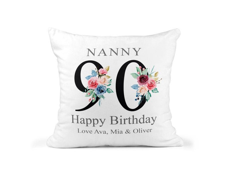 Personalised Nanny 90th Birthday Cushion with Names showing a floral milestone design front view
