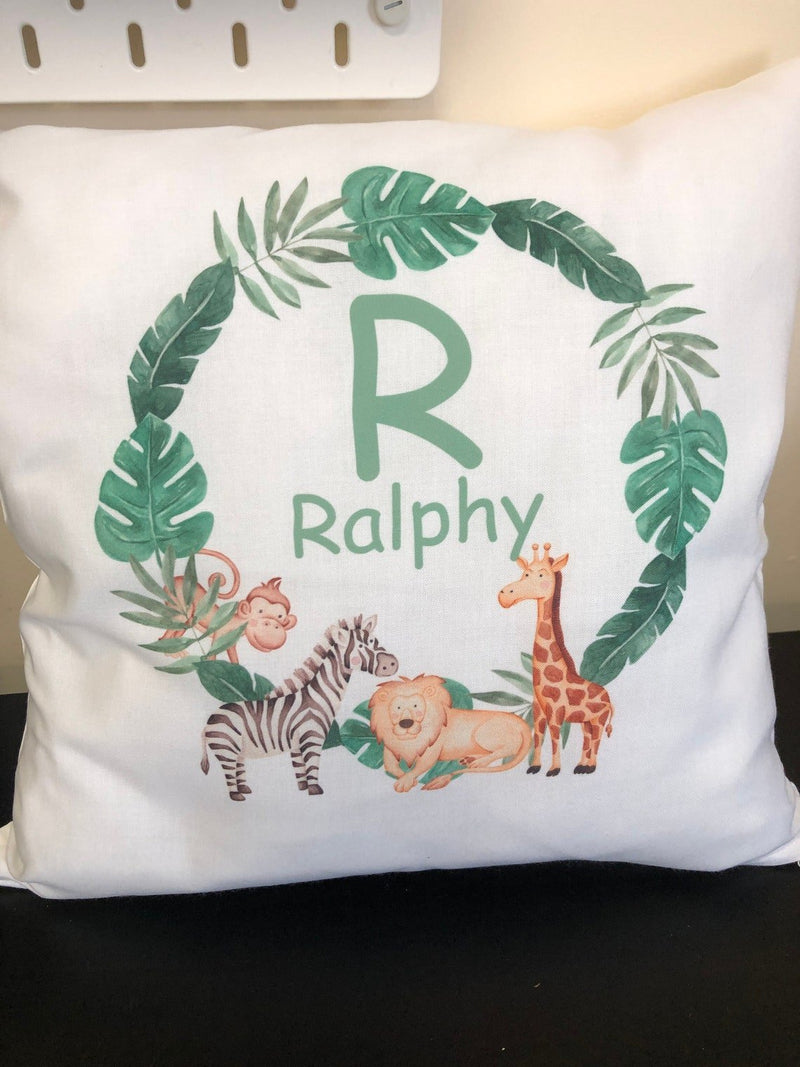 Personalised Jungle Cushion with Name and Initial showing friendly jungle animal artwork styled view