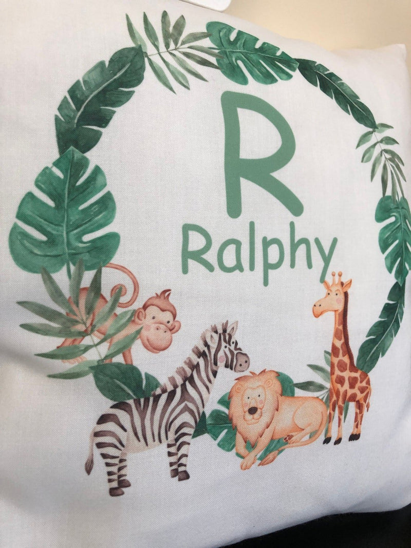 Personalised Jungle Cushion with Name and Initial showing friendly jungle animal artwork detail view
