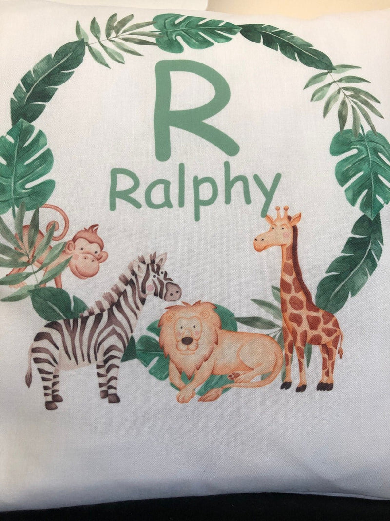 Personalised Jungle Cushion with Name and Initial showing friendly jungle animal artwork personalisation view