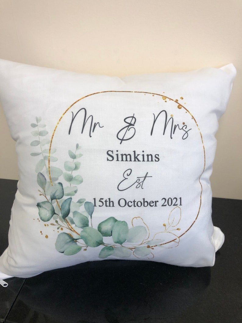 Personalised Gold Eucalyptus Wedding Cushion showing a wedding keepsake design styled view